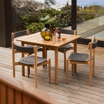 Стол и стул из тикового дерева во дворе в скандинавском стиле, плетеный стул из садовой веревки, водонепроницаемая комбинация стола и стула для отдыха Изображение